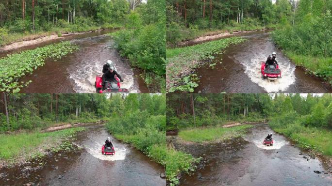 驾驶ATV穿越河流的人的空中镜头