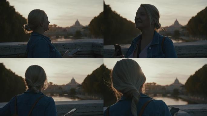 SLO MO女人走过桥，在日落时欣赏圣天使桥的景色