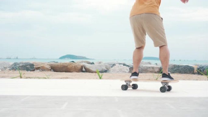 男子在海边的木板路上滑板