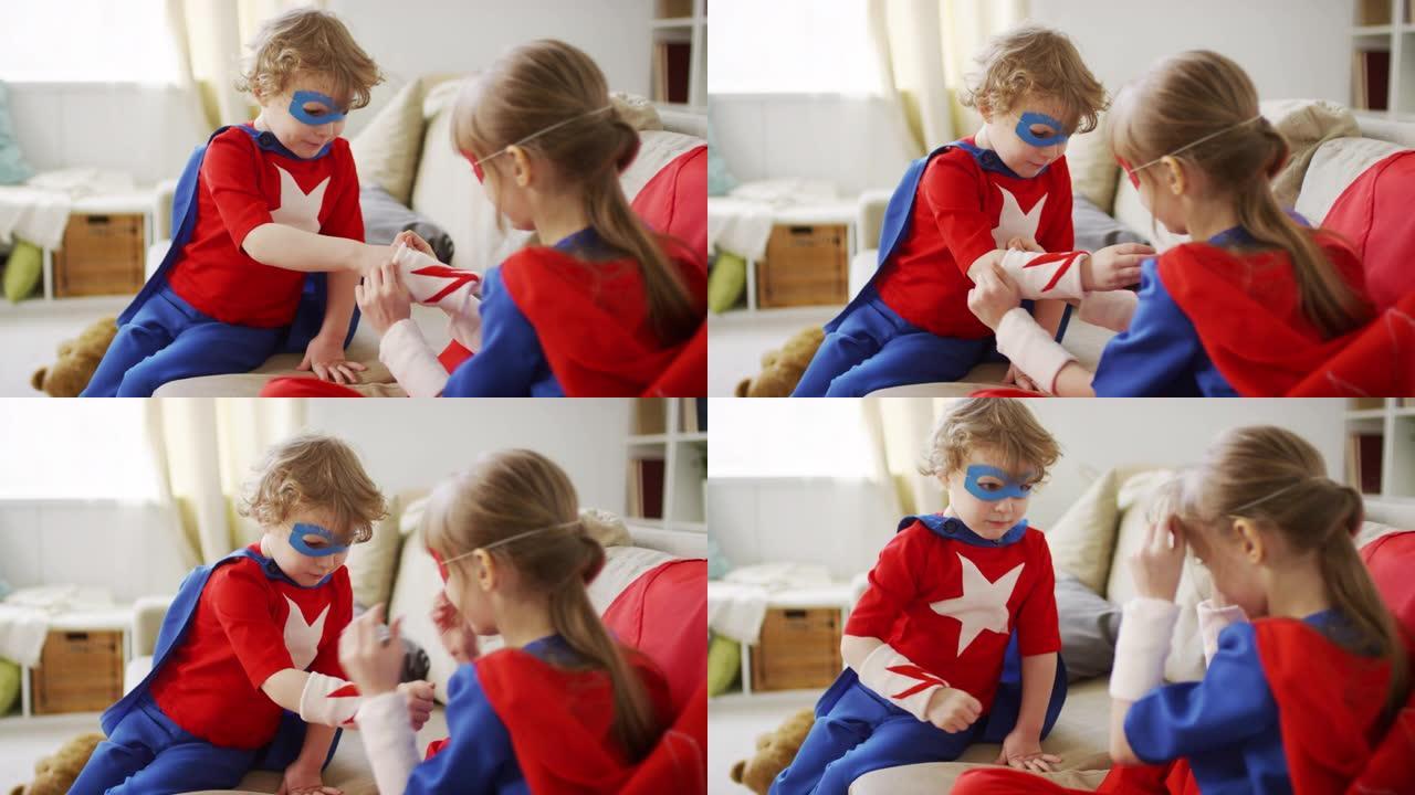 女孩帮助兄弟戴上超级英雄腕带