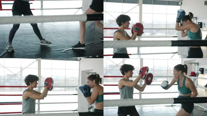 自信的年轻女运动员在健身房的拳击场上一起训练的倾斜肖像