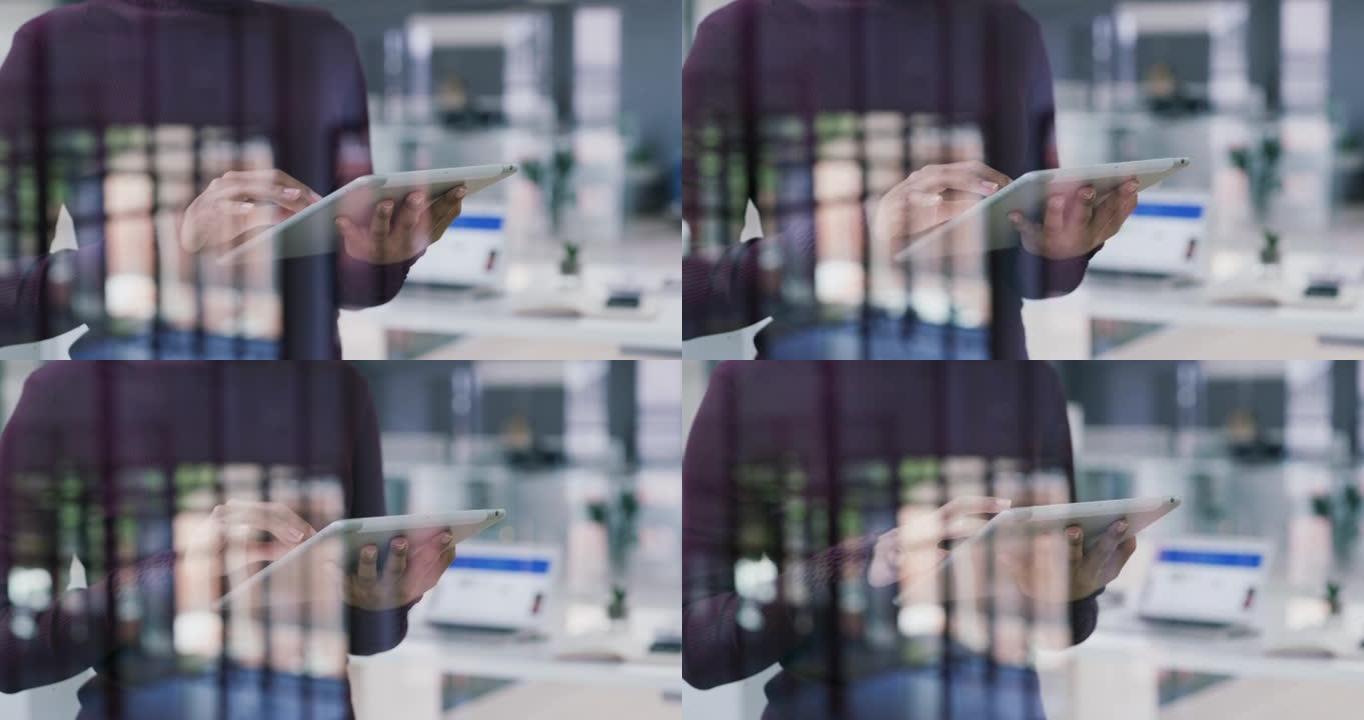 在现代办公室中使用数字平板电脑的无法识别的女商人的4k视频片段