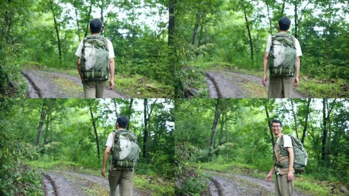 一名男子徒步穿越森林之路