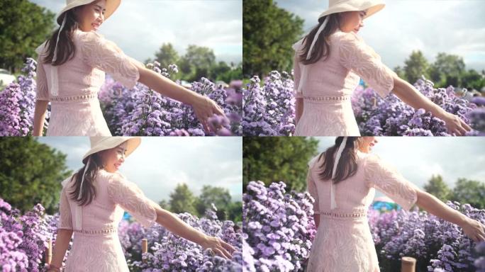 穿着白色连衣裙的女人走在花田里