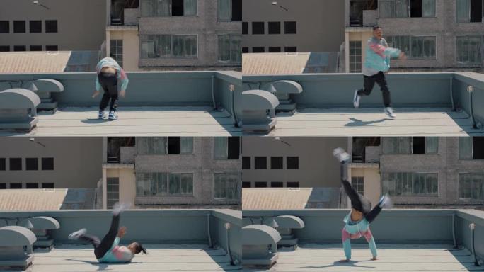 跳舞的人在屋顶上跳霹雳舞嘻哈舞者在城市练习舞蹈表演自由式动作