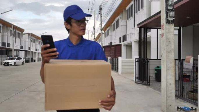 寻找送货目的地的亚洲送货员: 送货概念