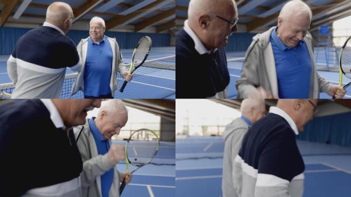 快乐的资深男子在运动场上打网球