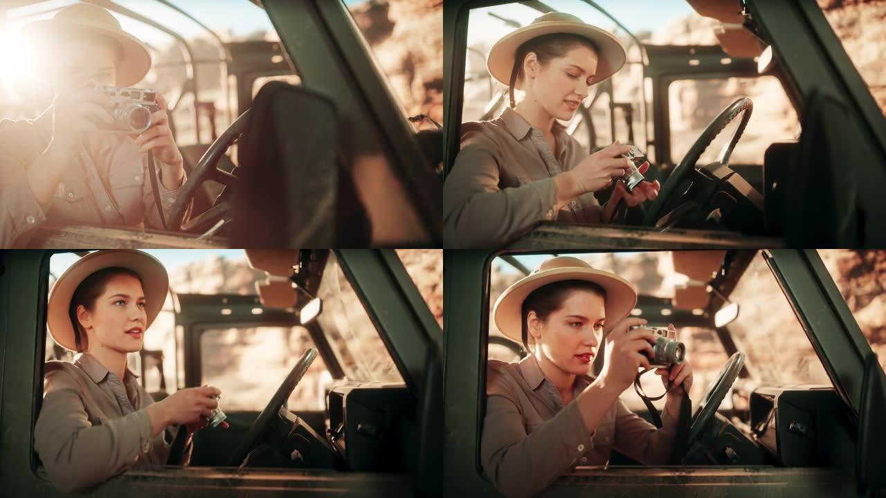 沙漠之旅: 专业女性旅行摄影师的肖像使用相机，通过汽车的侧窗拍照。越野越野车穿越岩石峡谷。记录惊人的