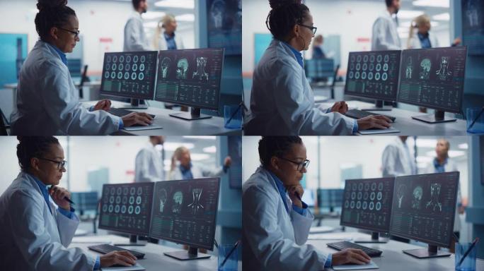 医学医院研究实验室: 黑人女性神经科学家使用计算机进行脑部扫描MRI图像，为患病患者找到最佳治疗方法
