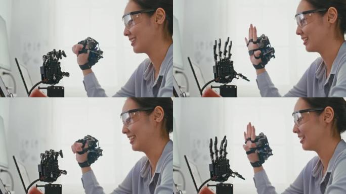 机器人手臂由专业开发工程师在高科技研究实验室中使用现代计算机设备进行测试