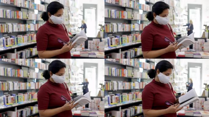戴着面具的女性在书店买书