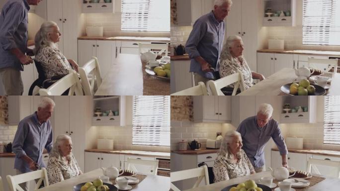 4k视频片段，一名高级男子在家中推着妻子坐在轮椅上