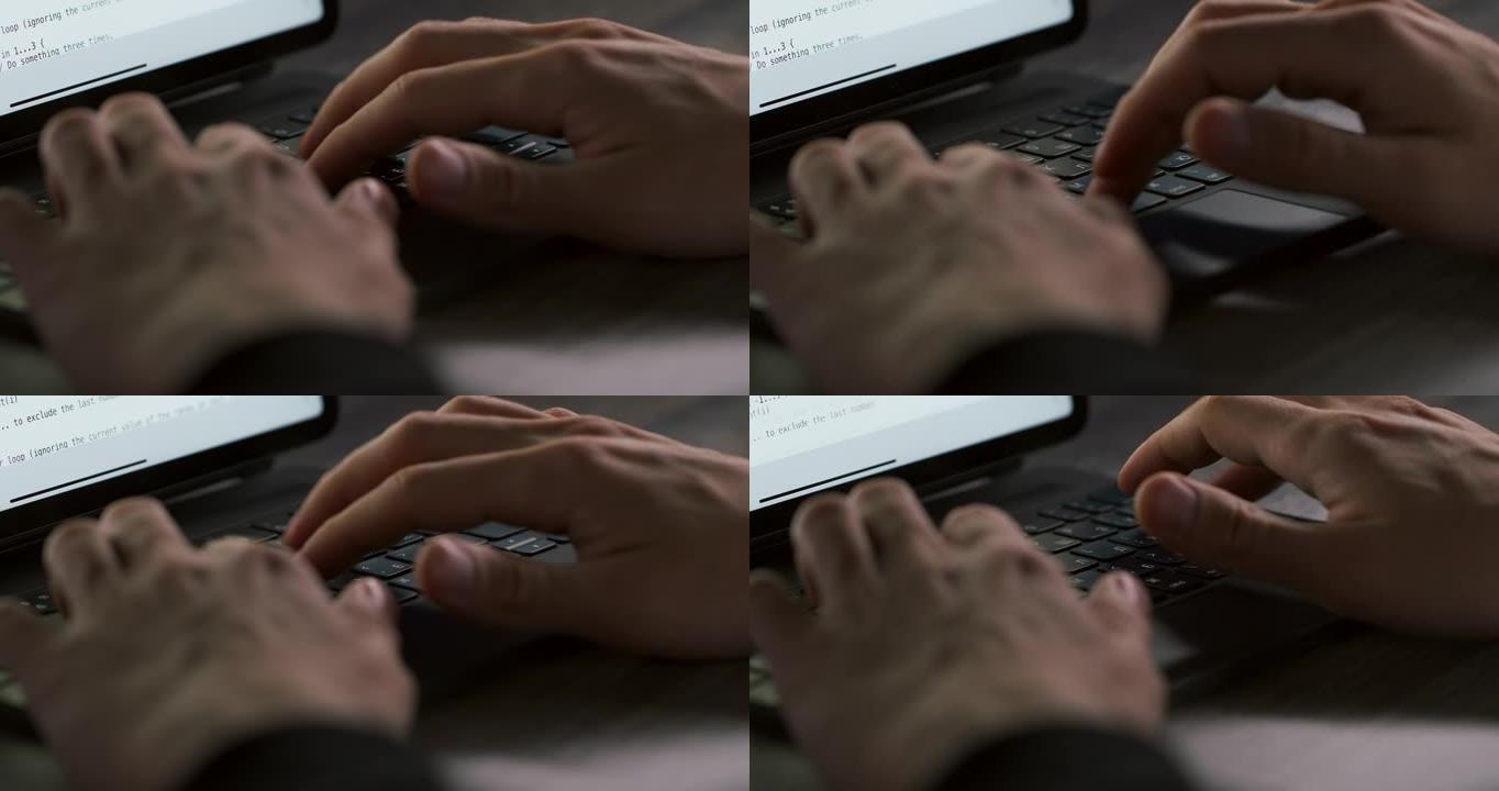 一只人手在黑色笔记本电脑键盘上慢动作近距离打字