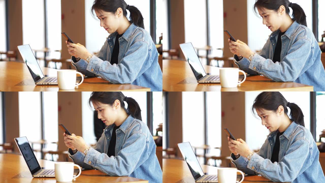 女人在咖啡馆使用手机