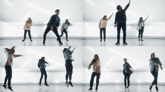由三个不同的时尚专业舞者组成的小组，在大型Led墙壁屏幕前表演嘻哈舞蹈程序，并为工作室环境中的虚拟制