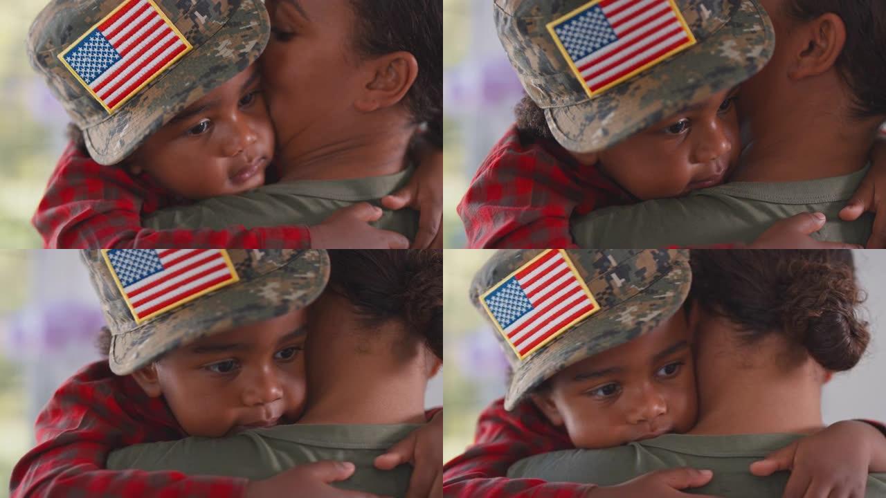 在厨房里，休假回家的美军母亲抱着戴着军帽的儿子的特写镜头——慢镜头