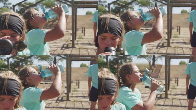 高加索女孩在新兵训练营喝水