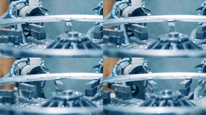 在自行车轮辋上打孔的机器的特写镜头