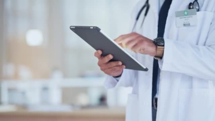 医生的手使用平板电脑在线向患者发送数字处方。医院医疗保健专业人员的特写，研究医学的最新突破和创新