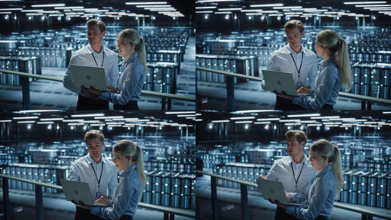 数据中心女性电子商务企业家和男性IT专家交谈，使用笔记本电脑。桥梁上的两名信息技术专业人员俯瞰着大型