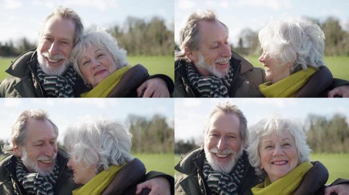 相爱的老年夫妇的肖像享受秋天或冬天一起穿过公园