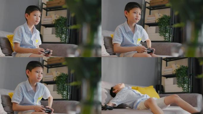 亚洲男孩在家里玩在线游戏机时被朋友击败