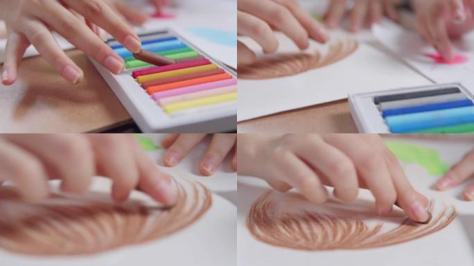 特写亚洲青少年女孩在客厅使用手指画和绘画艺术和工艺，而留在家里。他们使用油彩或粉笔颜色在纸上创作艺术
