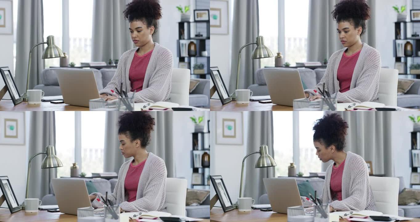 4k视频片段，一名妇女坐在家里在笔记本电脑上工作