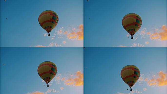 黄色热气球漂浮在宁静的蓝天中