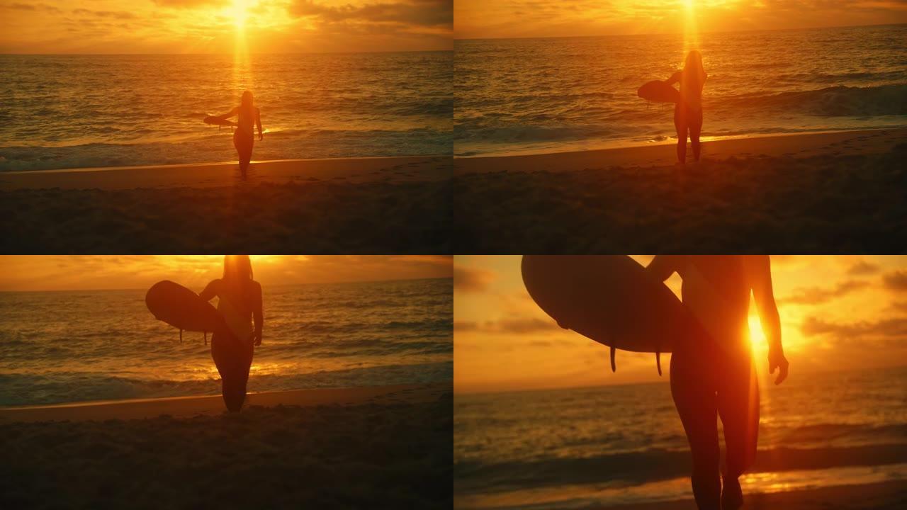 日落时分，留着长发的年轻女子背着冲浪板从海边走到海滩