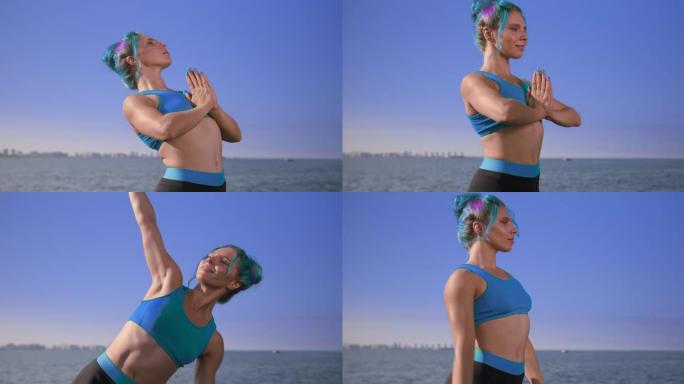 迷人的健身瑜伽老师，绿松石色的运动上衣站在天空和大海的背景下，展示了背部的一些伸展动作