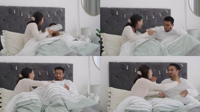 一对年轻夫妇在家一起在床上交换礼物的4k视频片段