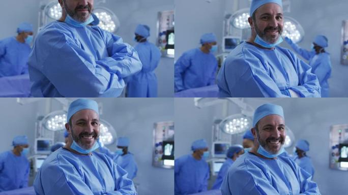 站在手术室的白人男性外科医生的肖像对着镜头微笑
