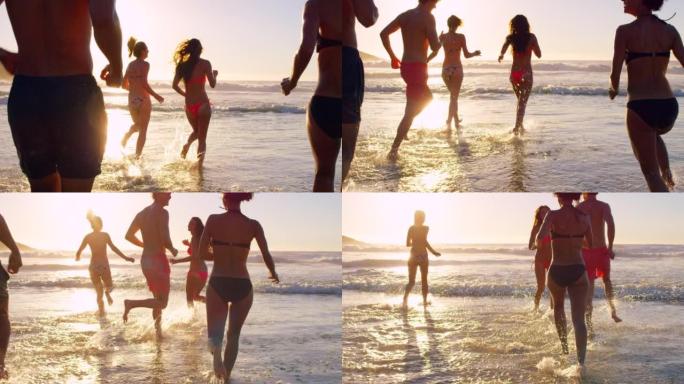 一群无法识别的朋友在日落时在海洋中建立联系和玩耍的4k视频片段