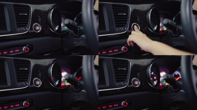 女性手推启动汽车发动机按钮。