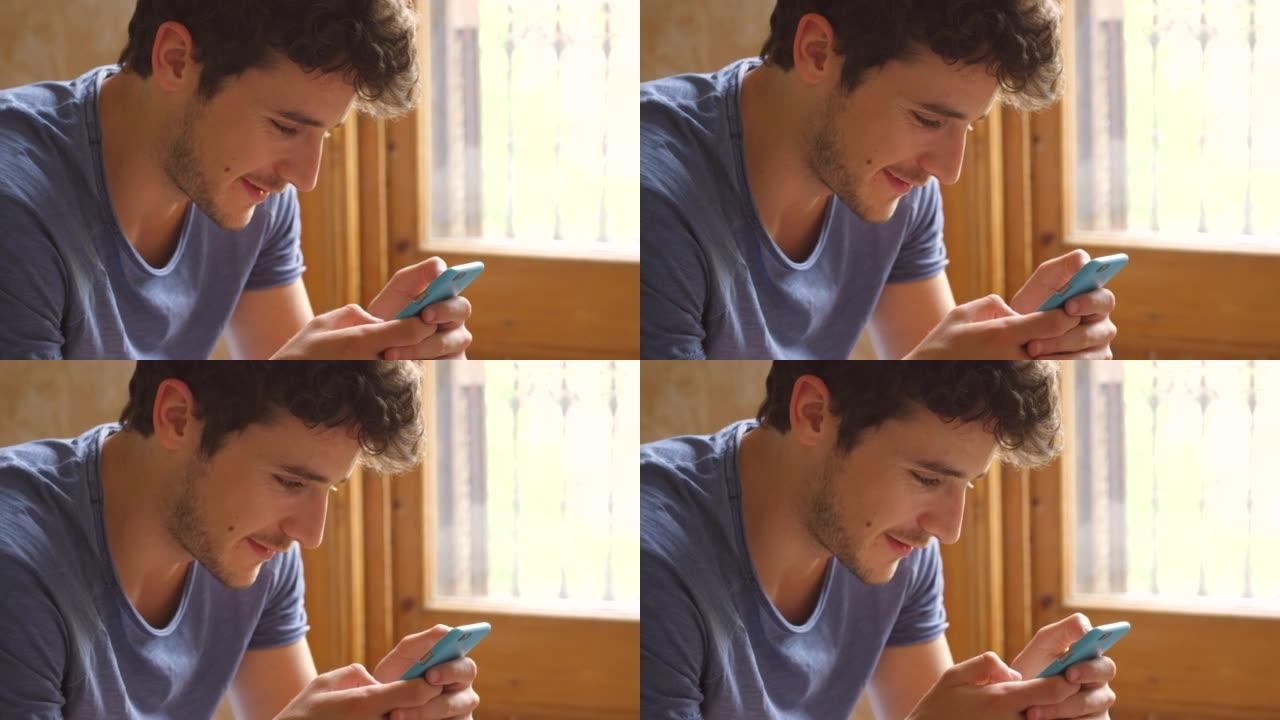 一个年轻人使用智能手机发送短信的4k视频片段