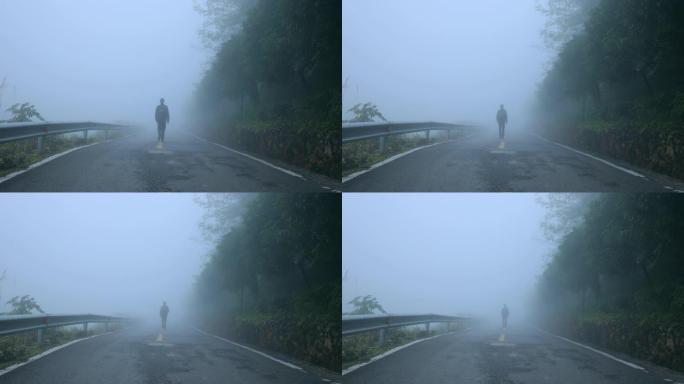 早上在雾路上行走的人