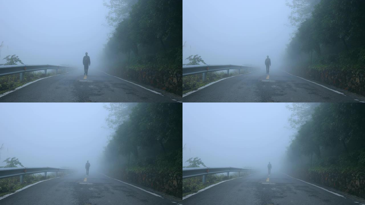 早上在雾路上行走的人