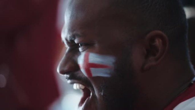 体育馆体育赛事: 英俊的黑人特写肖像，为红队获胜欢呼，尖叫着庆祝胜利。国际锦标赛，世界杯