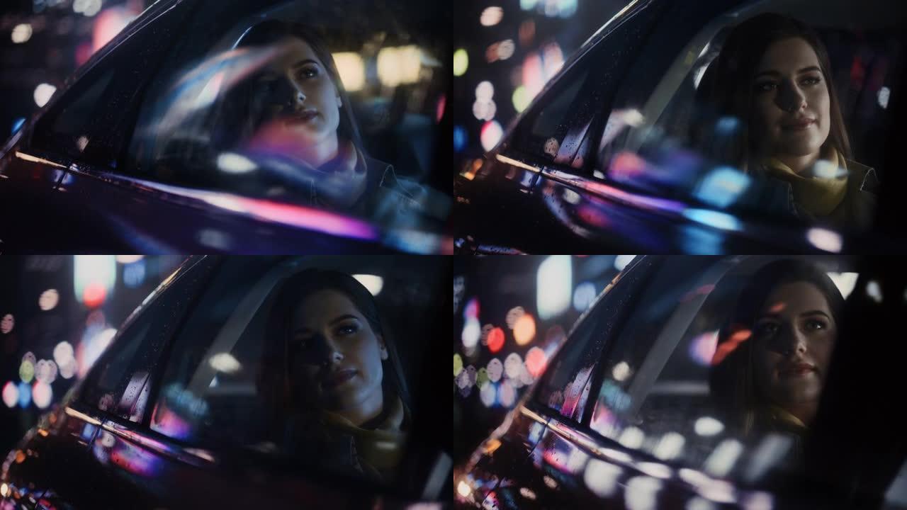 时尚的女性晚上坐出租车后座回家。美丽的女人乘客在城市街道上开着霓虹灯的汽车时看着窗外。电影镜头。
