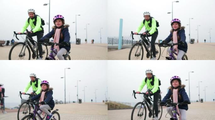 父女骑自行车带着孩子骑行保驾护航