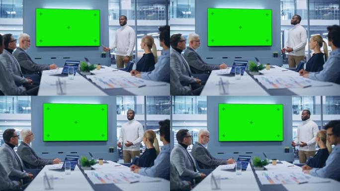 办公室会议室会议演示: 魅力四射的黑人商人谈话，使用绿屏色度键墙电视。成功向多民族投资者群体展示电子