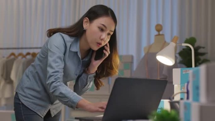 忙碌的亚洲小企业主企业家女人晚上打电话