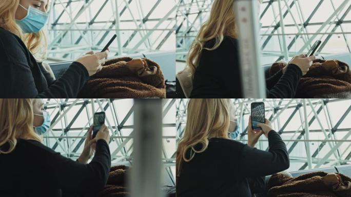 戴着医用口罩的女人在机场用手机拍照