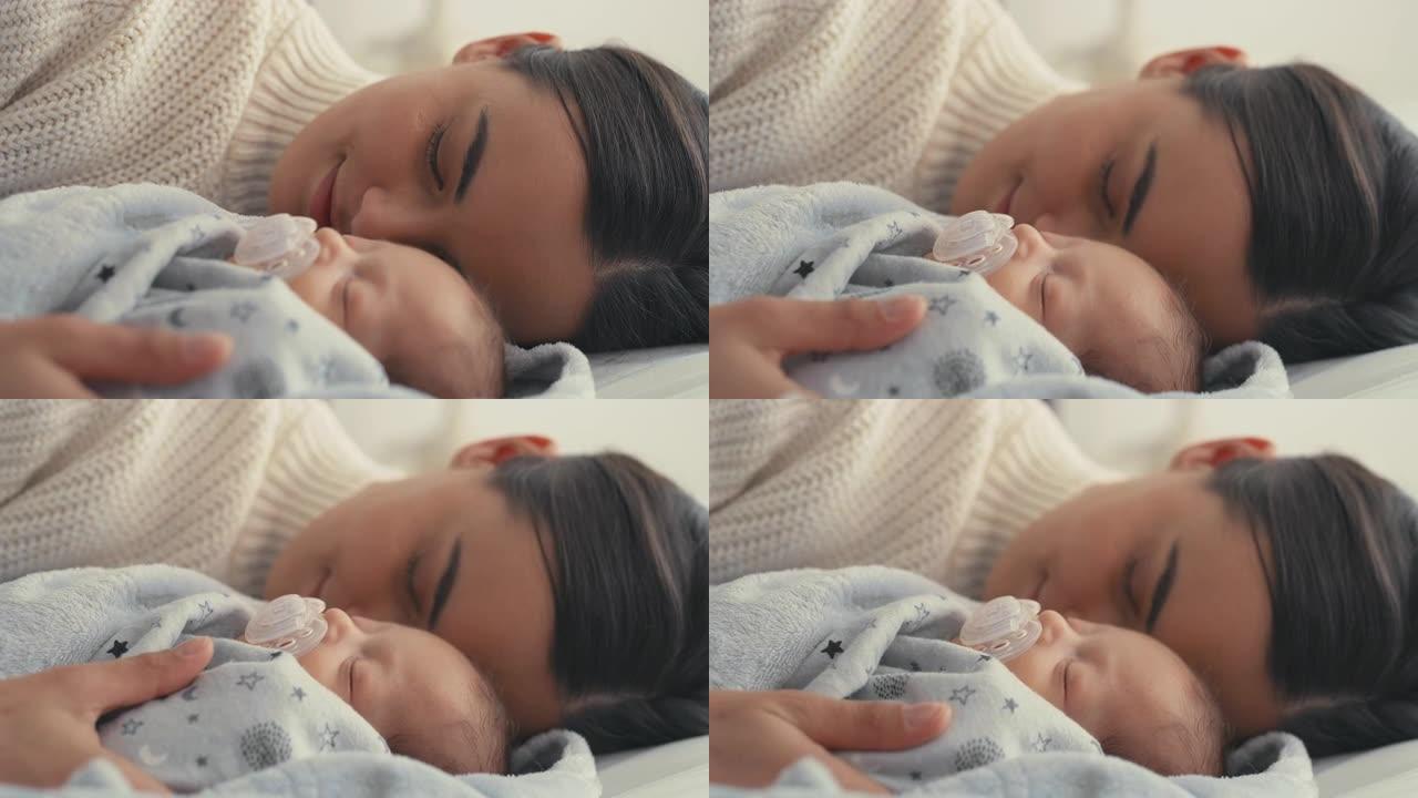 一个新生婴儿躺在他旁边睡着的4k视频片段