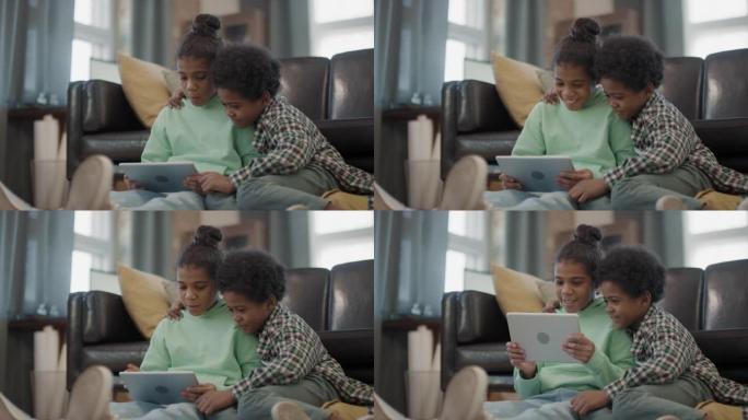 可爱的非洲儿童与数字平板电脑