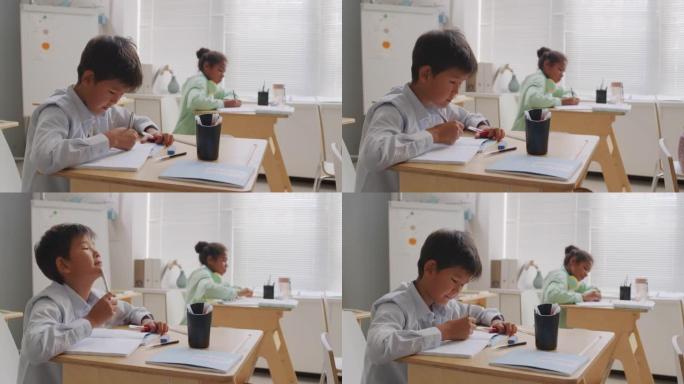 亚洲男孩在教室里参加考试