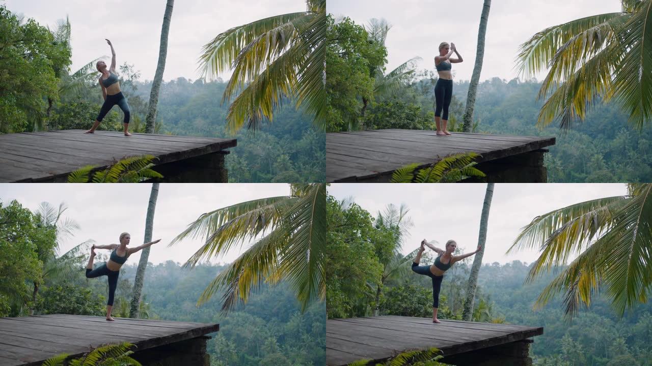 瑜伽女子练习舞蹈之王在热带丛林户外摆姿势享受正念练习4k