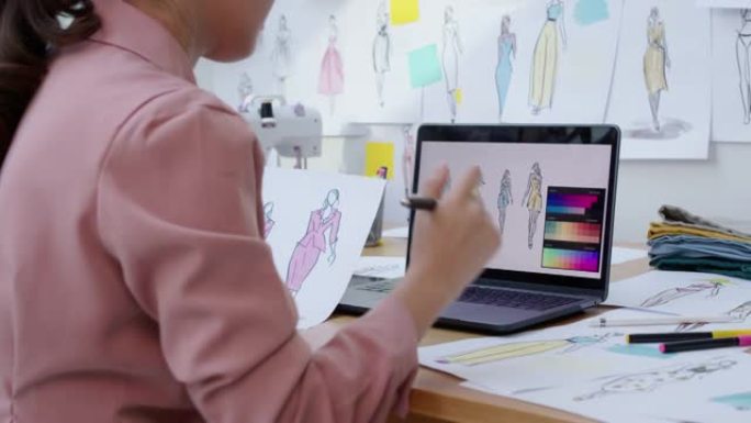 亚洲时装设计师素描画数码笔记本裁缝业务。