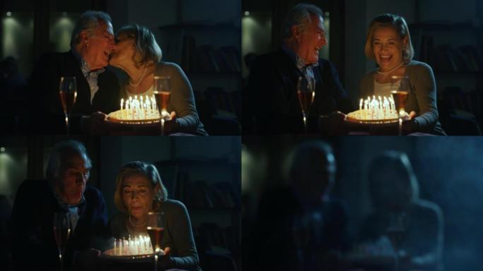 一对可爱的高级夫妇在庆祝他们的周年纪念日和永远的爱时，在蛋糕上吹蜡烛并接吻。